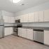 Kitchen with stainless appliances and white cabinets