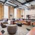 Community clubroom with TVs and a gourmet kitchen.