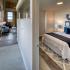View of hallway with bedroom and living space visible.