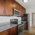 Kitchen with dark wood cabinets and island.