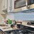 kitchen with stainless steel appliances and white cabinets