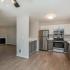 kitchen with stainless steel appliances and grey and white cabinets
