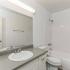 bathroom sink, shower, and toilet