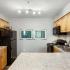 kitchen with black appliances and wood cabinets