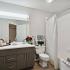 bathroom sink, shower, and toilet