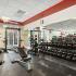 fitness center with cardio and weight machines and free weights