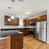 kitchen with stainless steel appliances and wood cabinets
