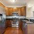 kitchen with stainless steel appliances and wood cabinets