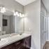 two bathroom sinks and a shower