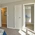 Furnished bedroom with walk-in closet