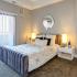Furnished bedroom with patio