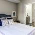 Furnished bedroom with attached bathroom