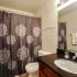 Bathroom with one sink, toilet, and shower