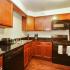 Kitchen with black appliances and wood cabinets