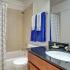 Bathroom with one sink, toilet, and shower