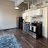 Kitchen with stainless steel appliances and grey and white cabinets