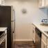 Kitchen with stainless steel appliances and white cabinets
