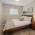 Bedroom with large bed and dresser