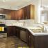 Kitchen with stainless steel appliances and wood cabinets