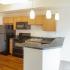 Kitchen with black appliances and wood cabinets