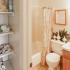 Bathroom with one sink, toilet, and shower and extra storage