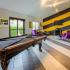 Game room with billiards table and TV lounge