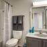 Bathroom with one sink, toilet, and shower