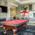 Game room with billiard table and TV