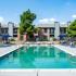 Pool with lounge chairs and umbrellas