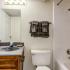 Bathroom with one sink, toilet, and shower