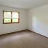 Vacant bedroom with large window