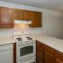 Kitchen with white appliances and wood cabinets