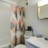 Bathroom with one sink, toilet, and shower