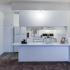 Kitchen with white appliances and white cabinetss