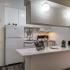 Kitchen with white appliances and white cabinets