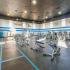 fitness center with cardio and weight equipment and free weights