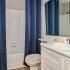 bathroom sink, shower, and toilet
