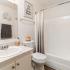 bathroom sink, shower, and toilet