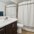 bathroom sink, shower, and toilet