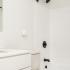 bathroom sink, shower, and toilet