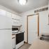 kitchen with white appliances and white cabinets