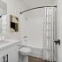 bathroom sink, shower, and toilet