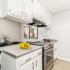 kitchen with stainless steel appliances and white cabinets
