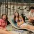 Residents Lounging at Pool Party