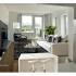 Arabella 101, interior, living room kitchen, large windows, wood floor, area rug, plush couch, chair, refrigerator,