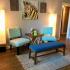 Overlook Club Living Area: Two decorative standing lamps, safari wall art, Hardwood flooring, Nice Furnishings
