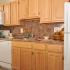 Kitchen with updated white appliances, gas range, dishwasher, frost free fridge