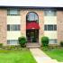 Cranberry Run Apts, Exterior, 3 story buildings, manicured grass, shrubs, and bushes