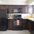 Kitchen fully updated with black appliances (gas range, dishwasher, microwave, fridge)