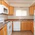 Belmont Apts; Interior, kitchen, electric range, dishwasher, oak cabinets, window in kitchen, wood plank floor
